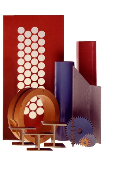 machining plastic fabrication company parts that're red, purple, and brownish